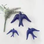 glazed dark blue swallows wall hanging