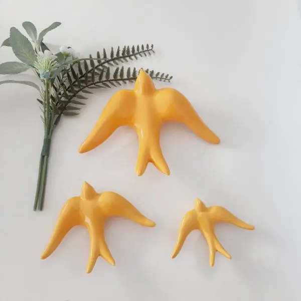 glazed yellow swallows wall hanging