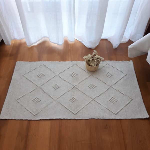 small beige rug geometric
