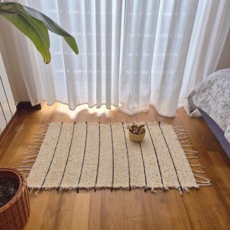 ecru rug with black lines
