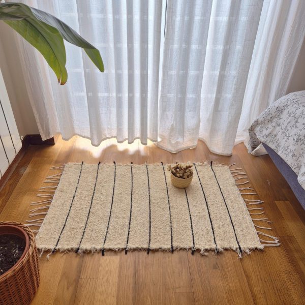 ecru rug with black lines