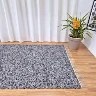large black and grey rug with spots