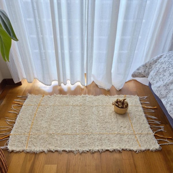 small cream and yellow rug