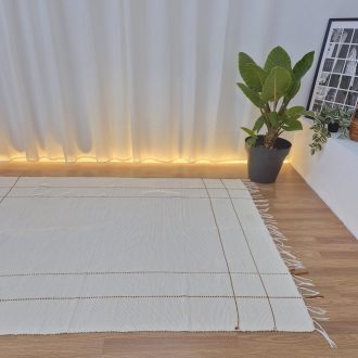 cream rug with mustard yellow lines
